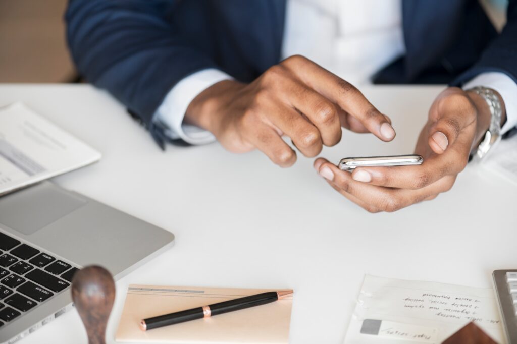 closeup of businessman using mobile phone