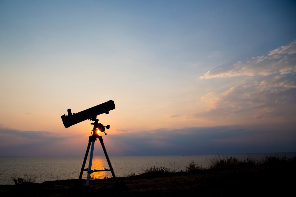 the telescope silhouette at orange sunset