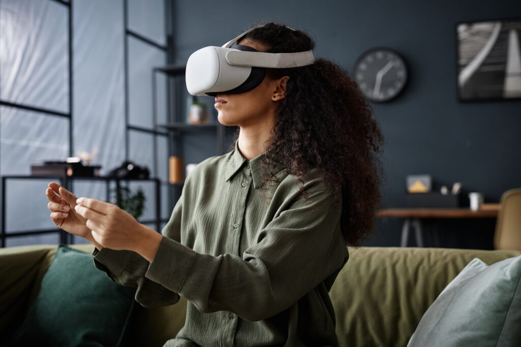 woman with curly hair using vr headset